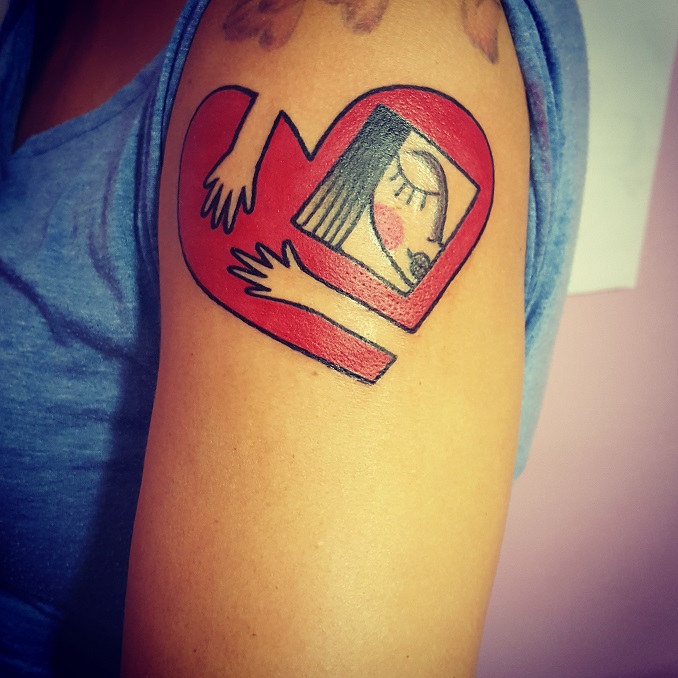 Tatuaggio abbraccio cuore Modena